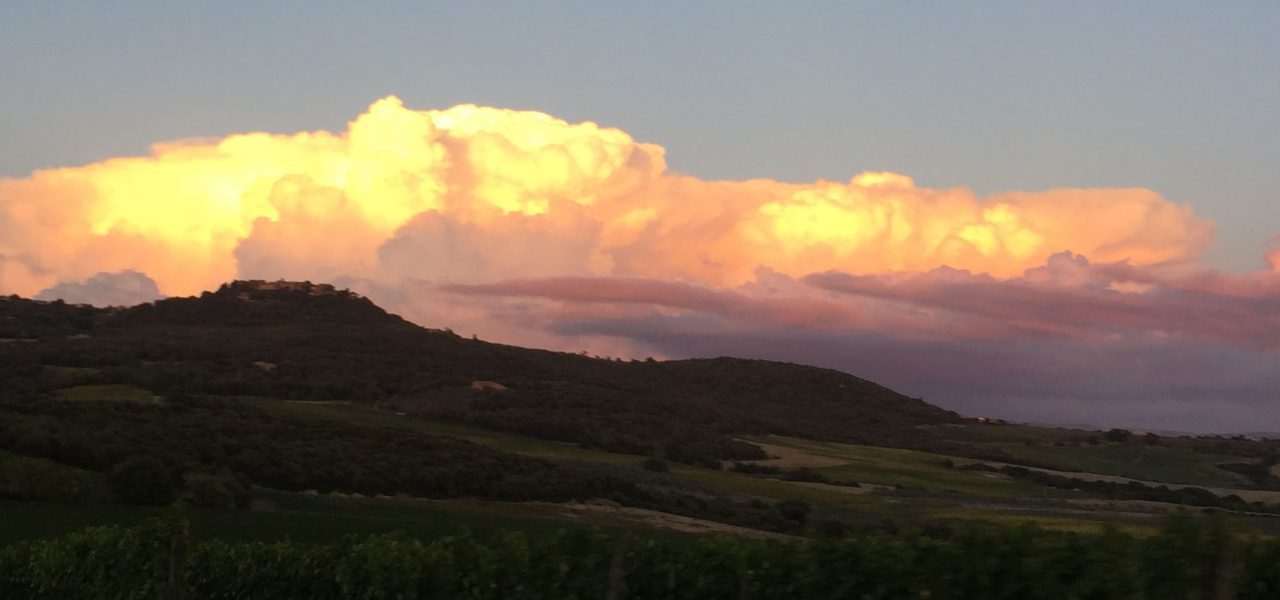 clouds and sunset behind hills