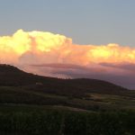 clouds and sunset behind hills